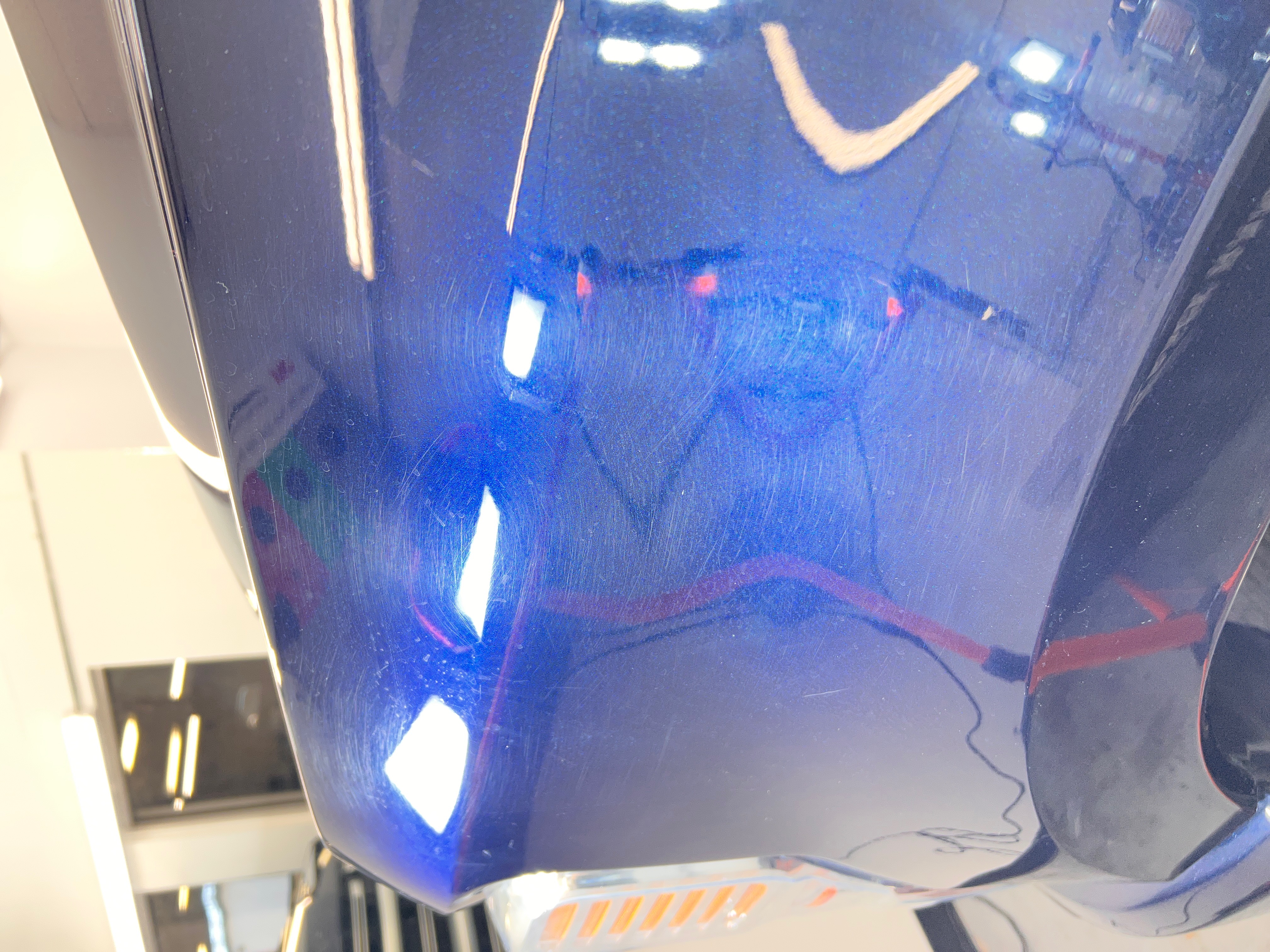 Blue paint before correction with swirl marks